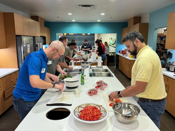 New Dynamics team preparing dinner of the Ronald McDonald house.